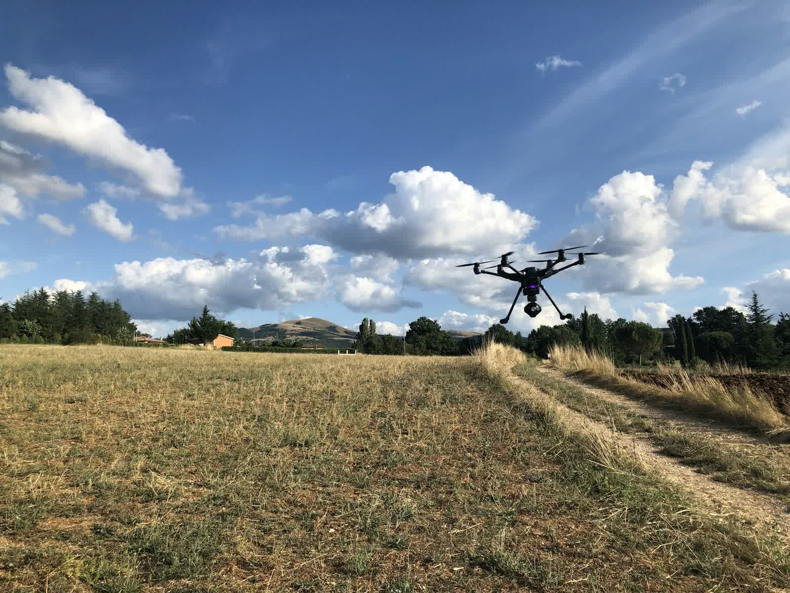 Agricultural drone flying over a farm field