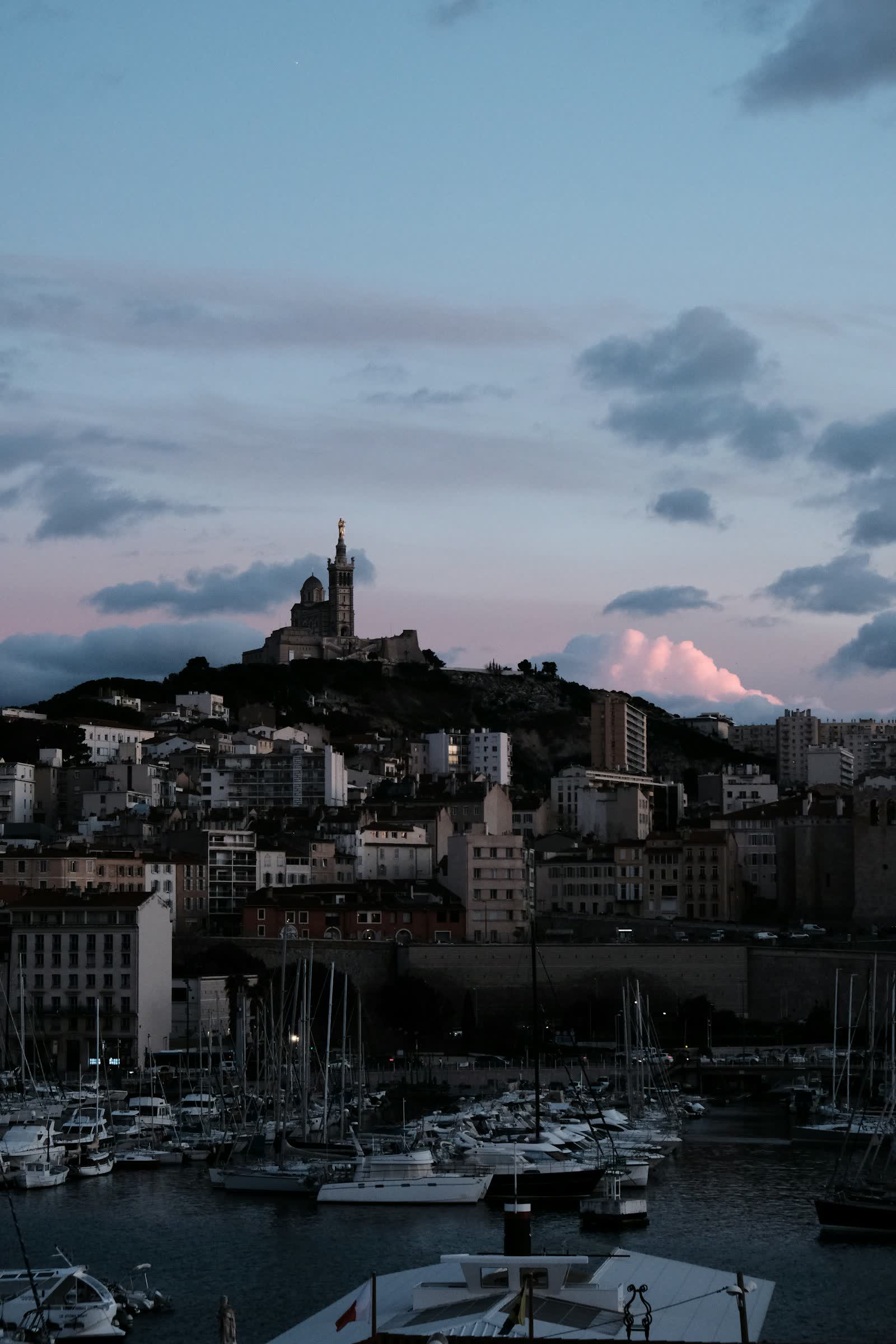 Marseille Old Port and Notre-Dame-de-la-Garde basilica at dusk
