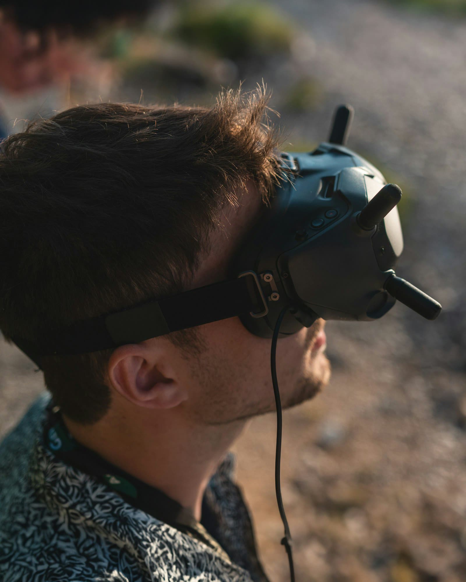Pilot wearing FPV goggles for immersive drone flight