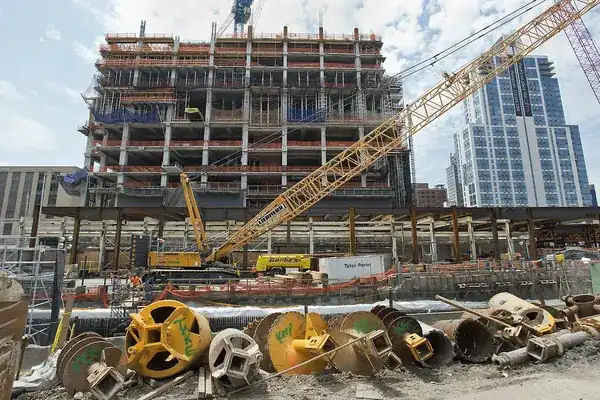 Crane and structure under construction on a large building site