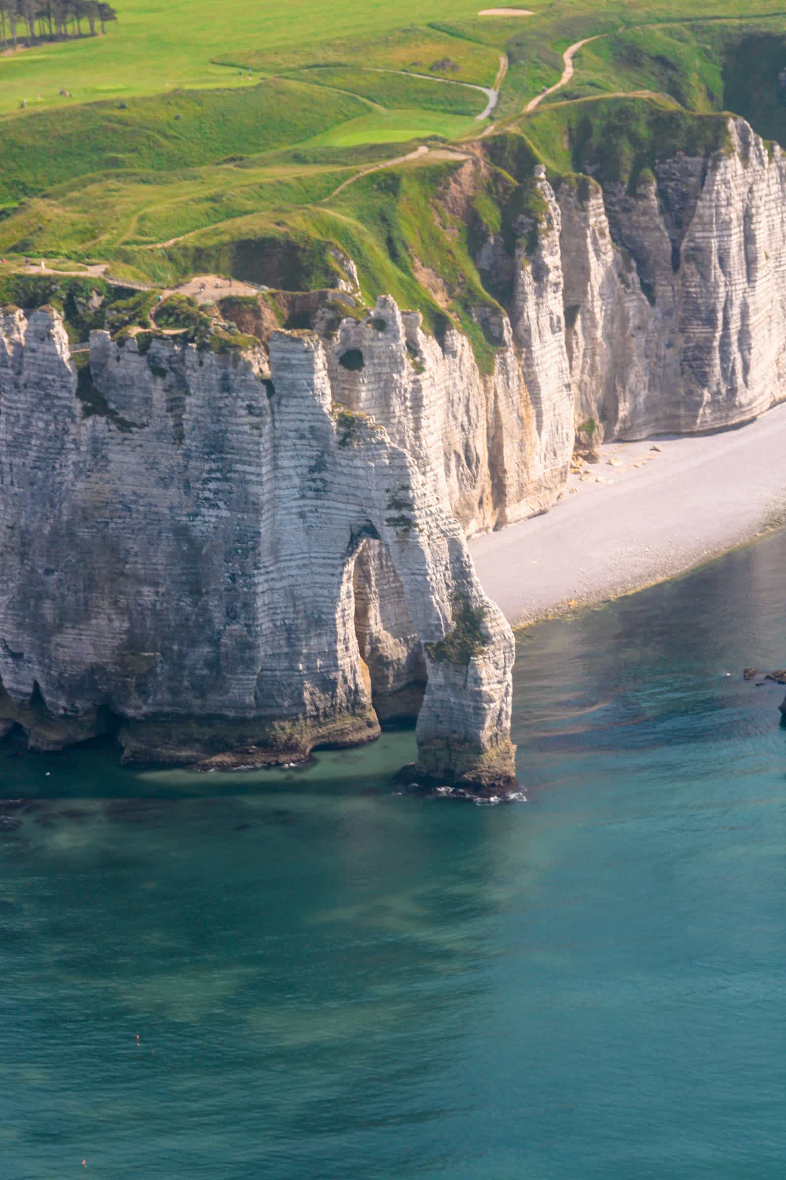 Aerial view of the Étretat chalk cliffs and their arch in Normandy, France